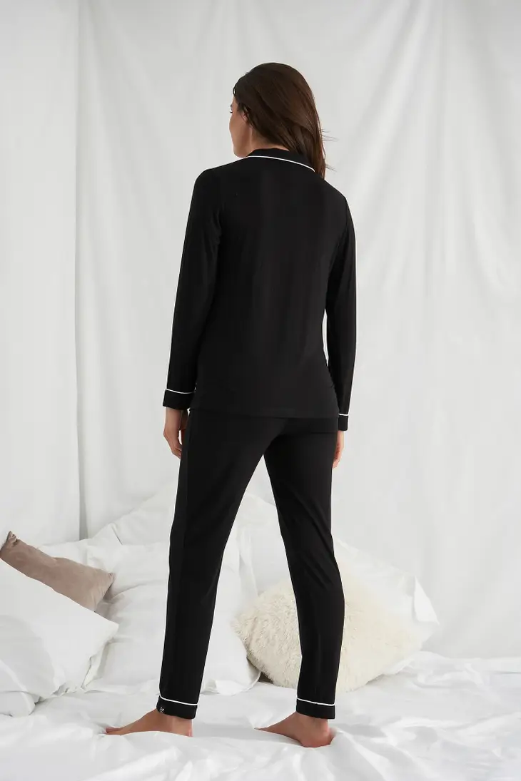 Back view of women's black bamboo pajamas. 
