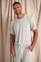 Men's bamboo pajama short set in grey matching shorts with drawstring and side pockets. Top is a t-shirt style with 3 buttons