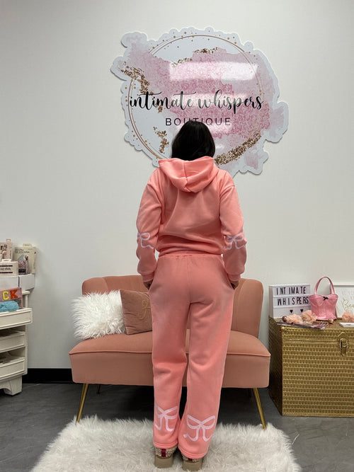 Pink sweatset with bow detail on back of legs and elbow. 