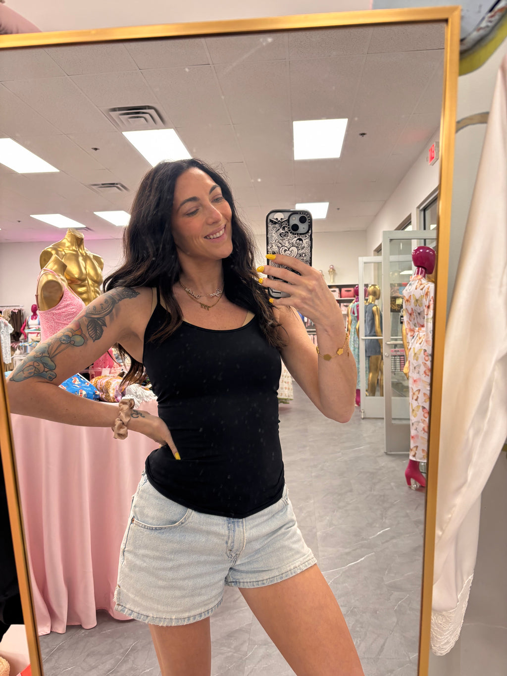 Seamless black camisole tank top on model