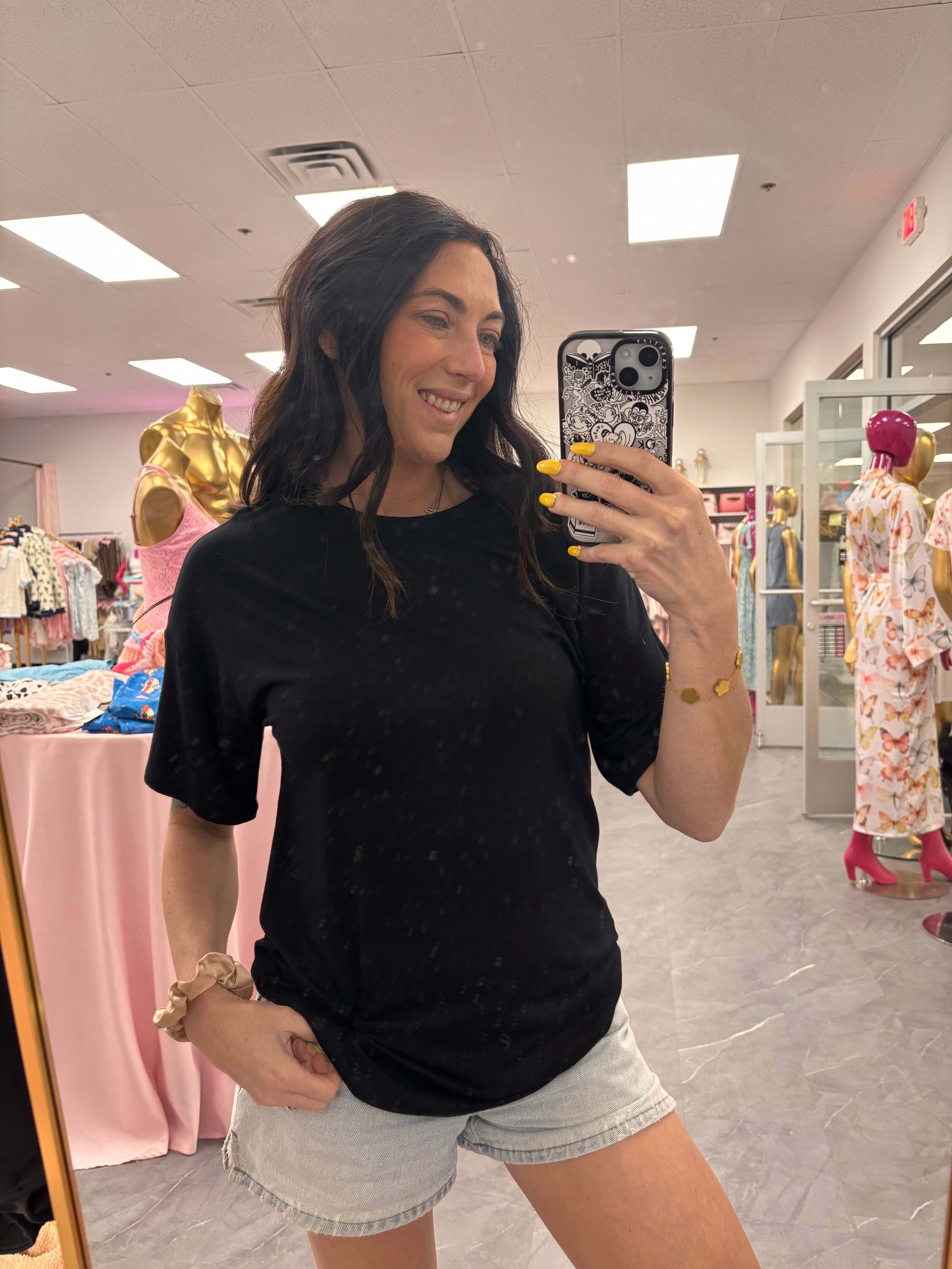Women's classic black t-shirt front view on model