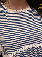 Women's blue peplum striped top details
