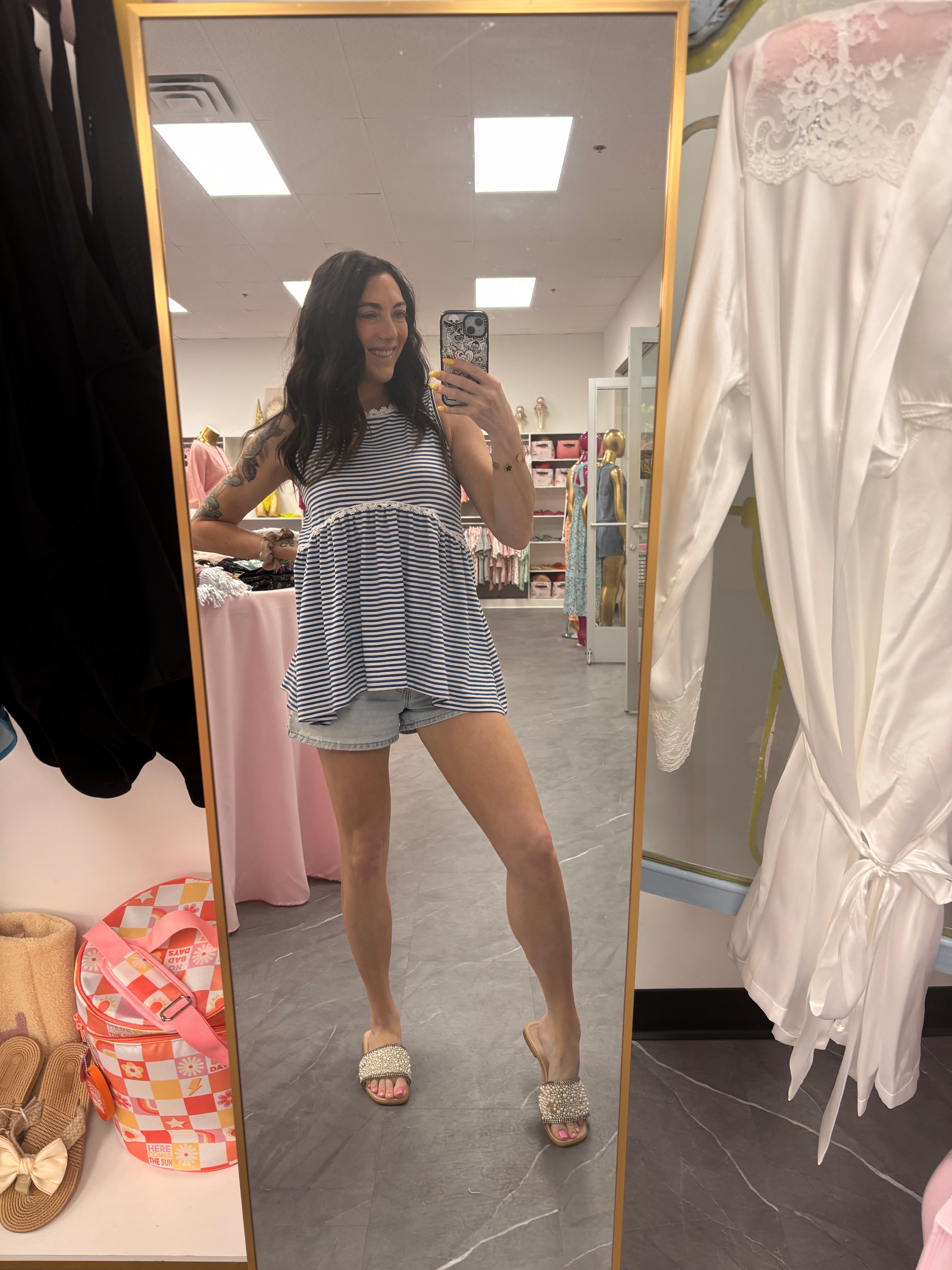 Women's blue striped peplum top full model