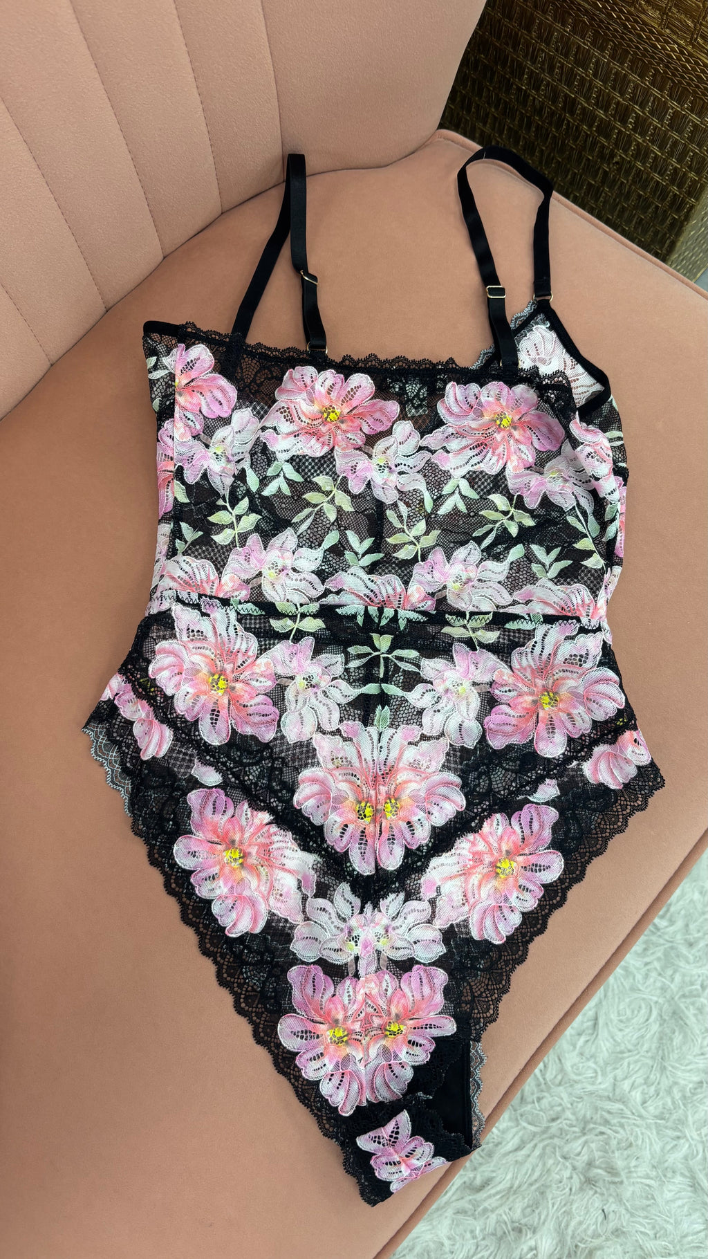 Women's pink and white floral with black lace bodysuit teddy flat lay back