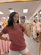 Women's mauve vneck waffle shirt with lace sleeves on model close up