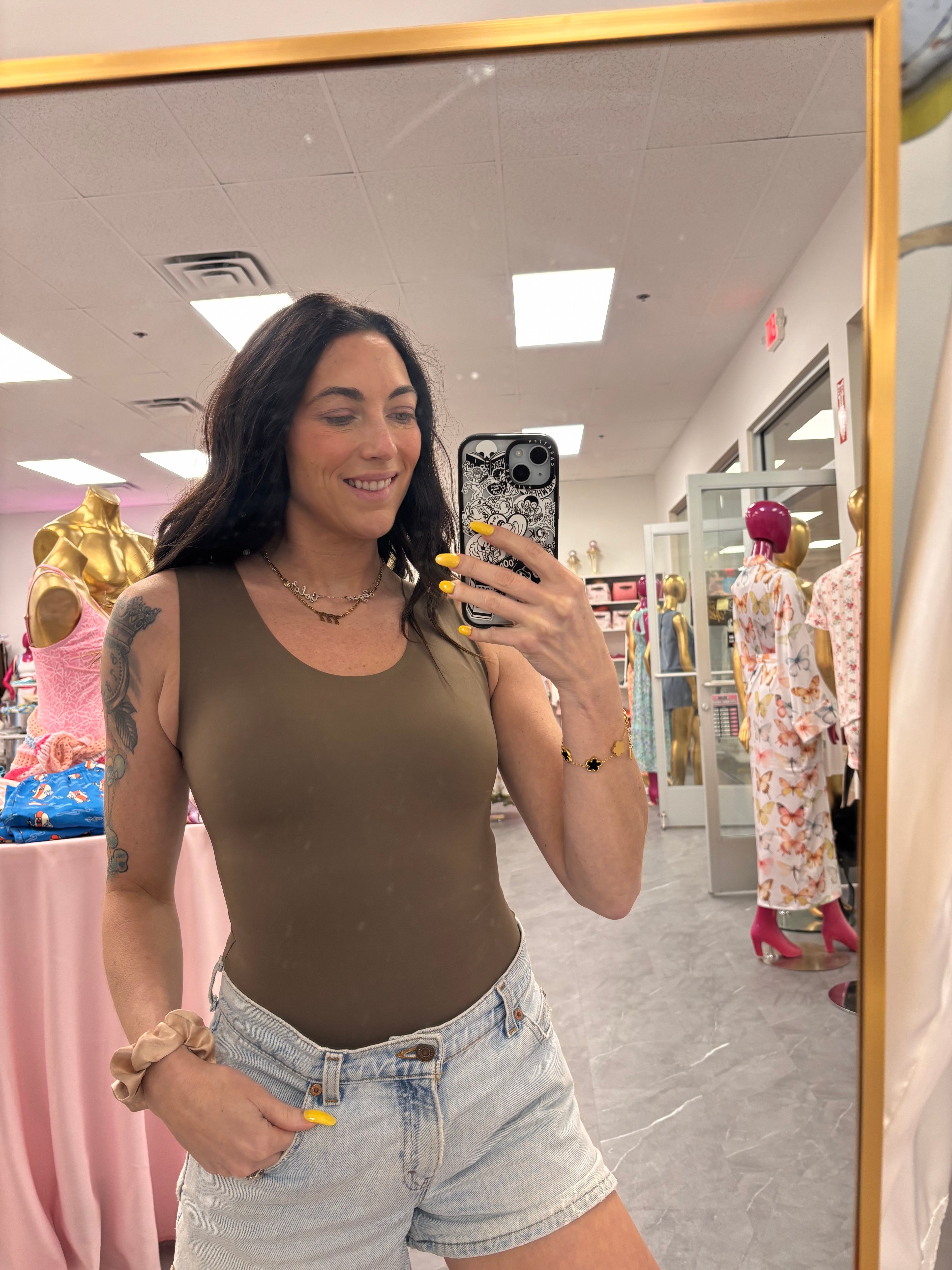 Mirror selfie photo of okko slimming mocha brown bodysuit.