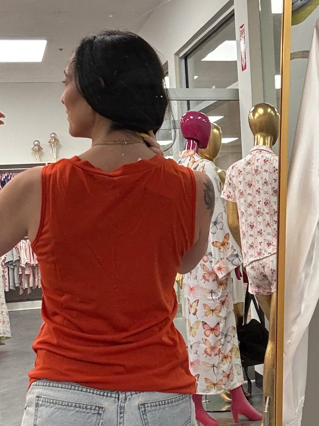 Women's orange v-neck tank top back view