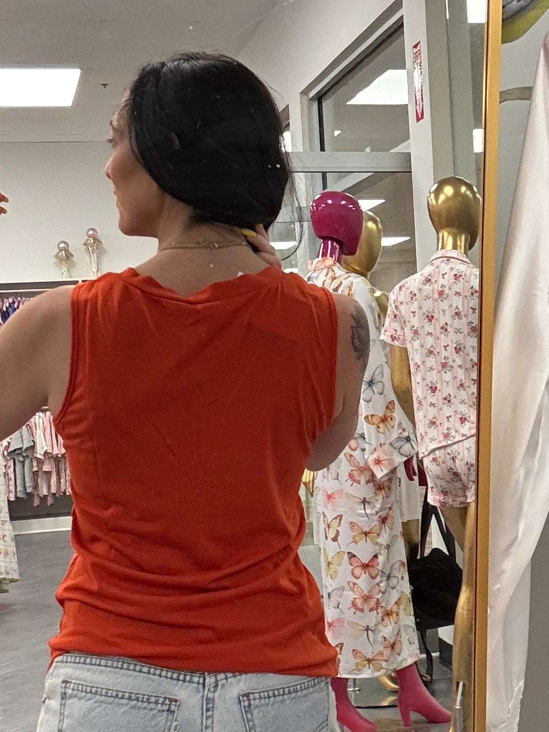 Women's orange v-neck tank top back view