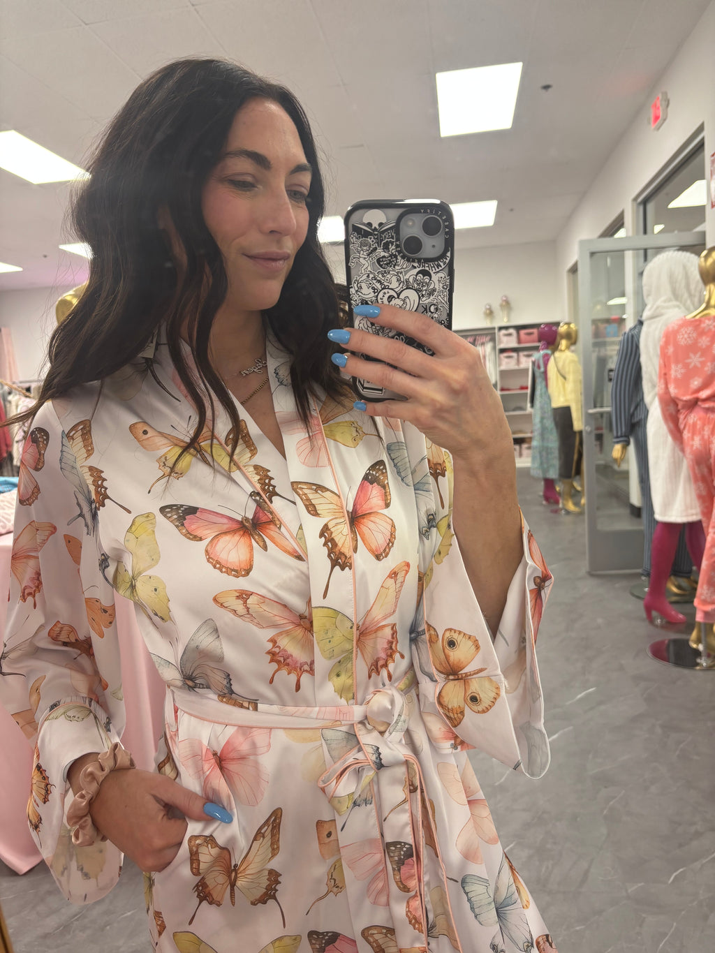 Close up detail of women's satin butterfly long robe with pockets
