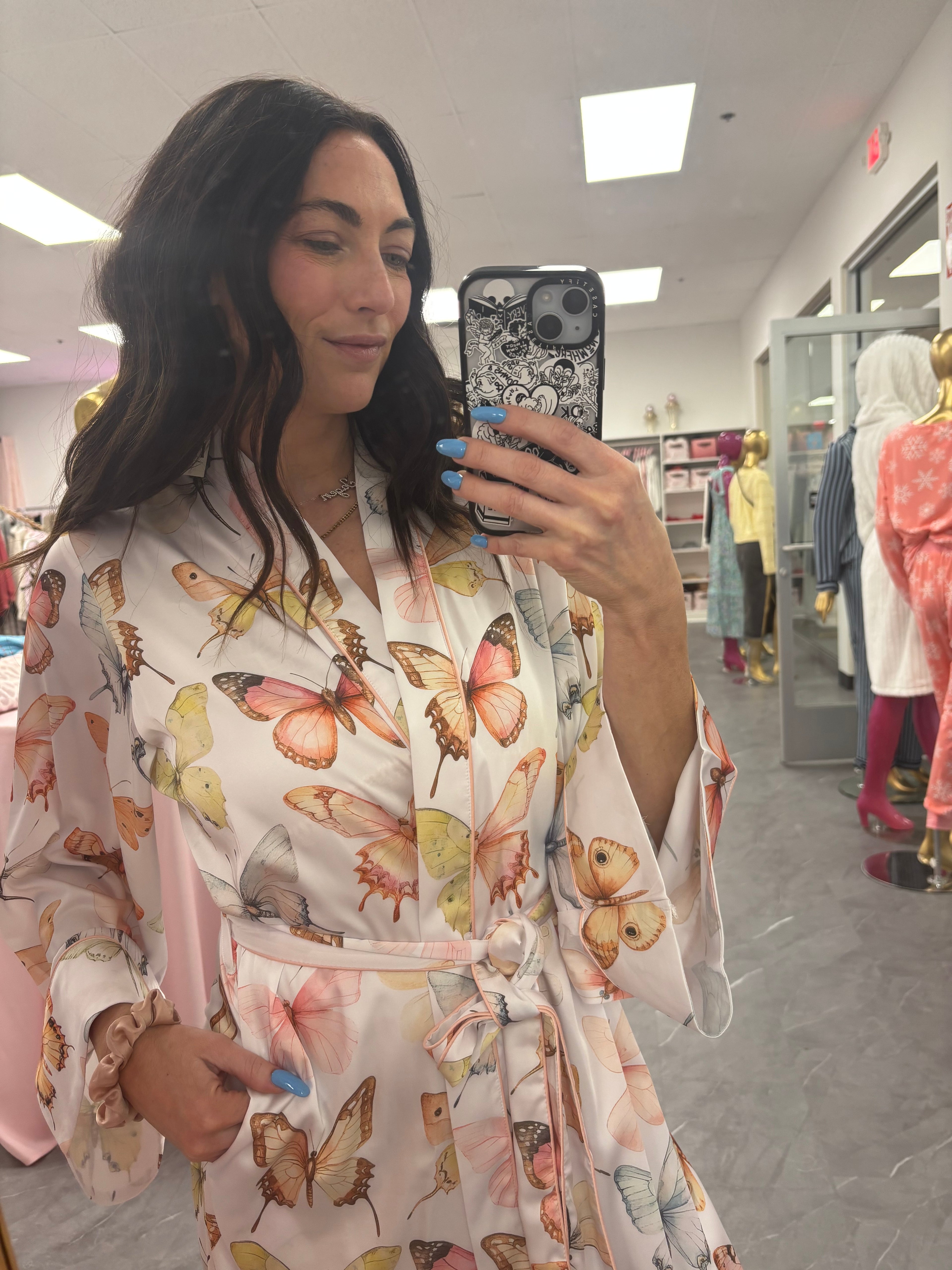 Close up detail of women's satin butterfly long robe with pockets