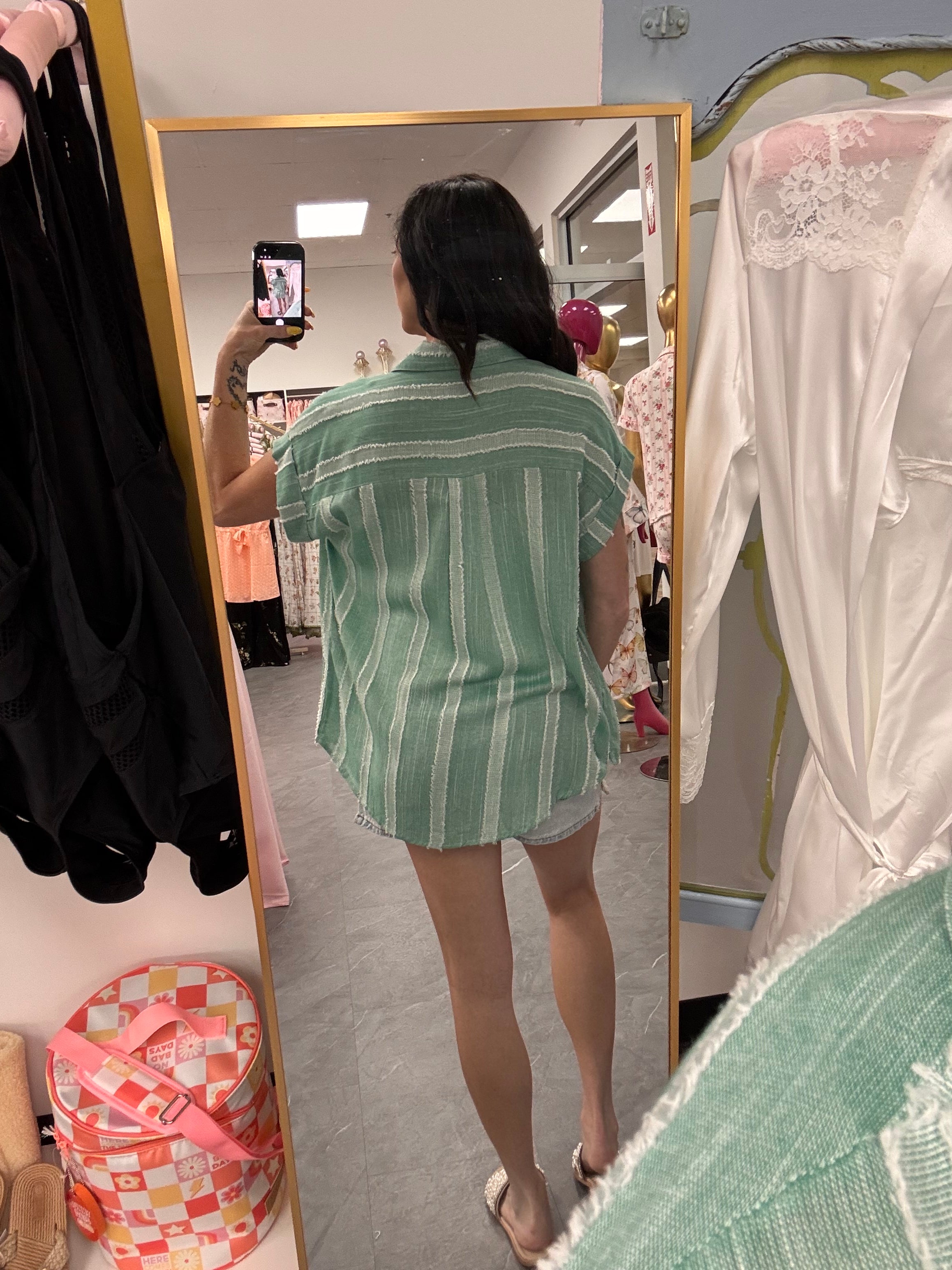 Women's frayed mint button up back detail on model