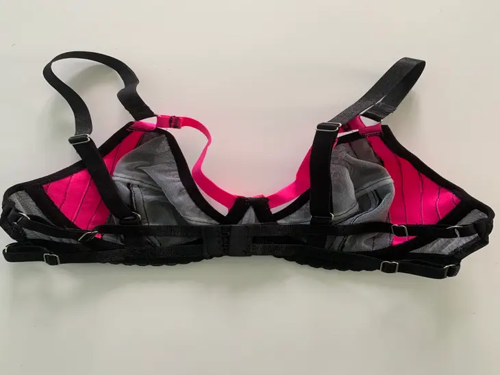 Women's black and hot pink bra with ribbon detail back view