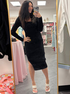 Women's black ribbed midi sweater dress long sleeve square neck with slit on model