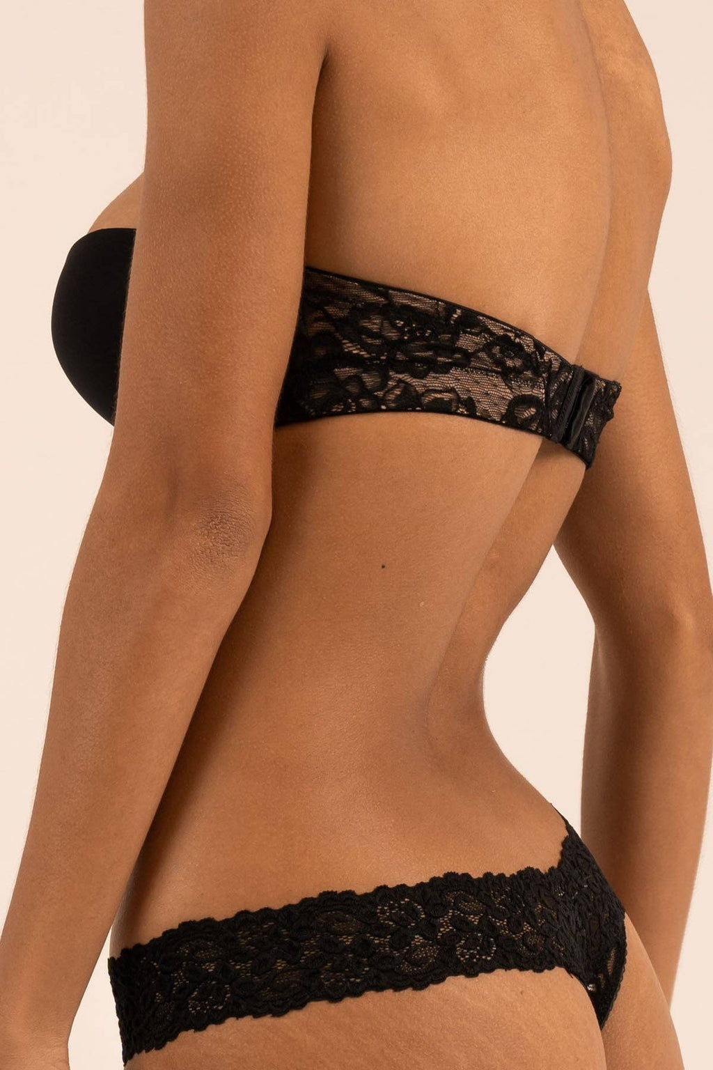 Women's black strapless bra with straps to wear multiple ways on model front