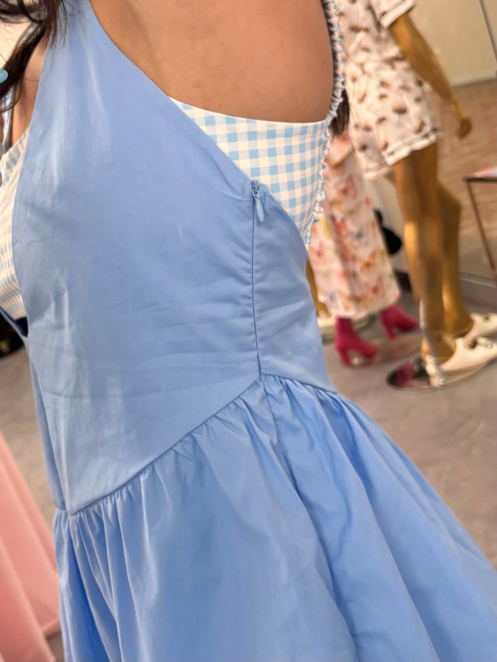 Women's blue gingham athletic dress with shorts underneath and pockets zipper detail
