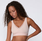 Women's blush pink pull over seamless bralette with lace front view