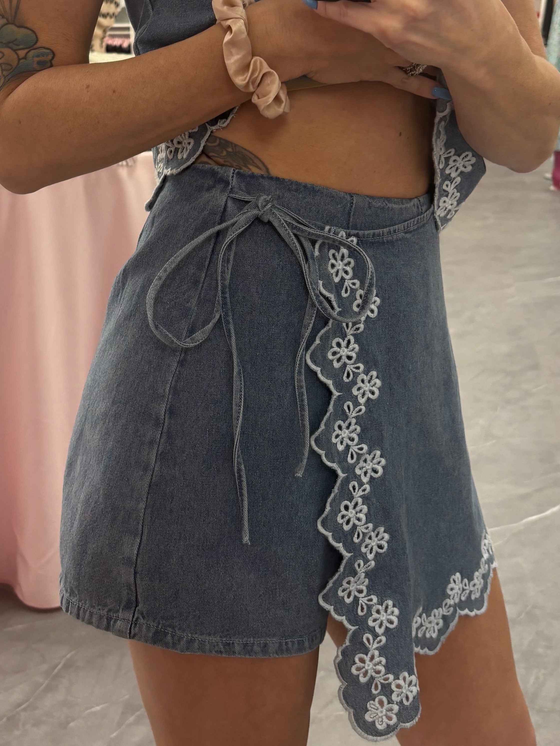 Women's denim embroidered skort on model side detail