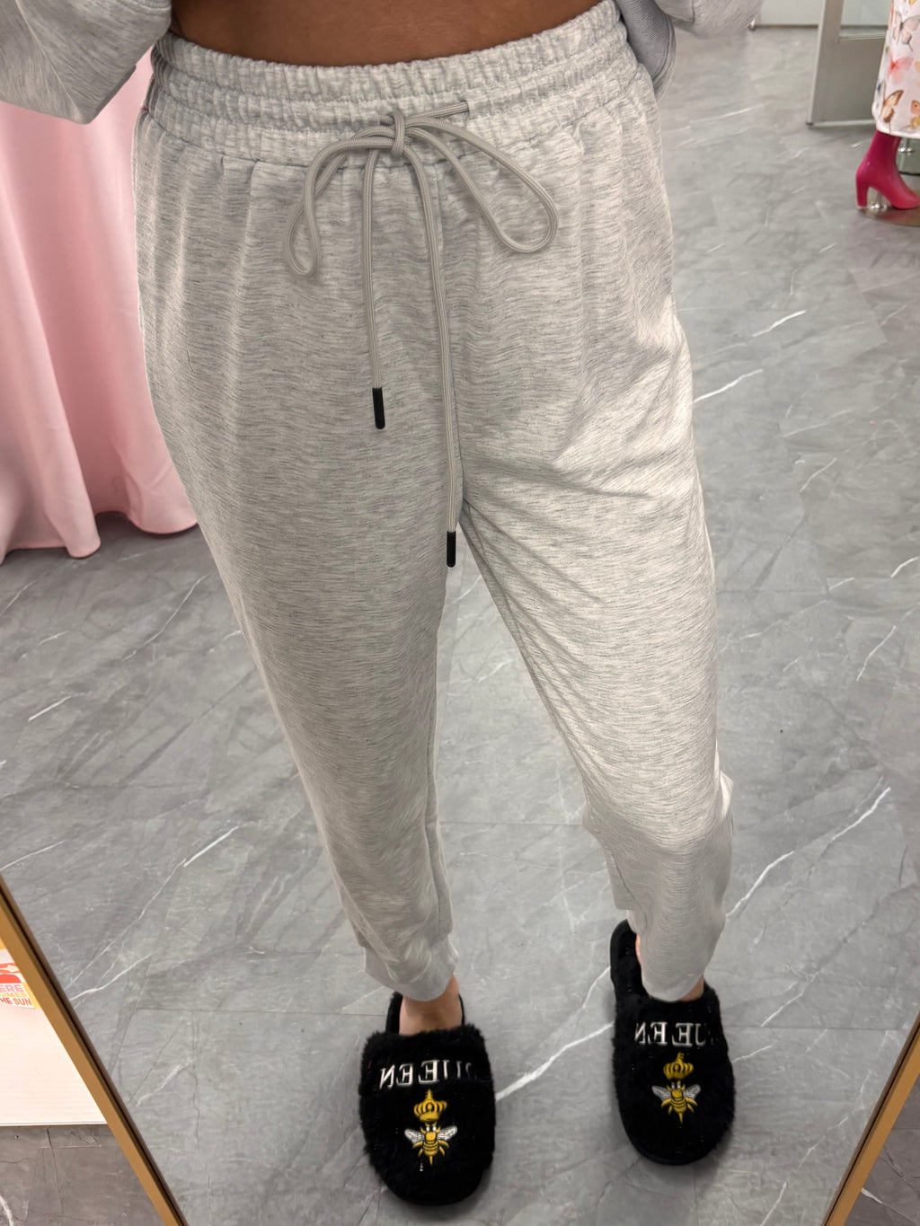 Women's grey sweat set lounge with quarter zip and jogger style drawstring pants