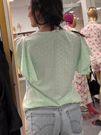 Women's mint green top on model