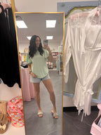 Women's mint green top on model