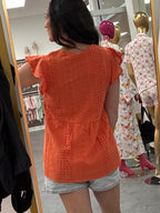 Women's orange peplum babydoll top with buttons