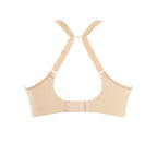 A woman wearing panache elegance beige, moulded cup bra with adjustable straps.