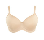 A woman wearing panache elegance beige, moulded cup bra with adjustable straps.