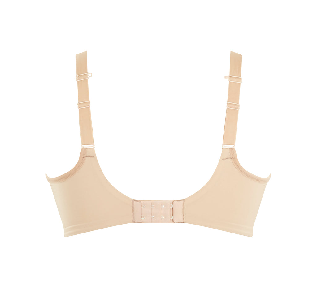 A woman wearing panache elegance beige, moulded cup bra with adjustable straps.