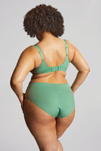 This image features the "Esme - Wonderland" deep brief, which is designed with a charming and whimsical aesthetic. The briefs are presented in a light mint green color, adorned with a playful pattern of animals and floral elements.