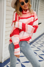 Women's tones of pink and white abstract pattern sweater with turtleneck on model