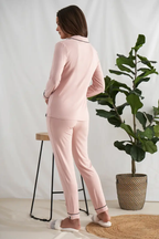 Women's pink bamboo pant pajama set with black piping buttons and front pocket