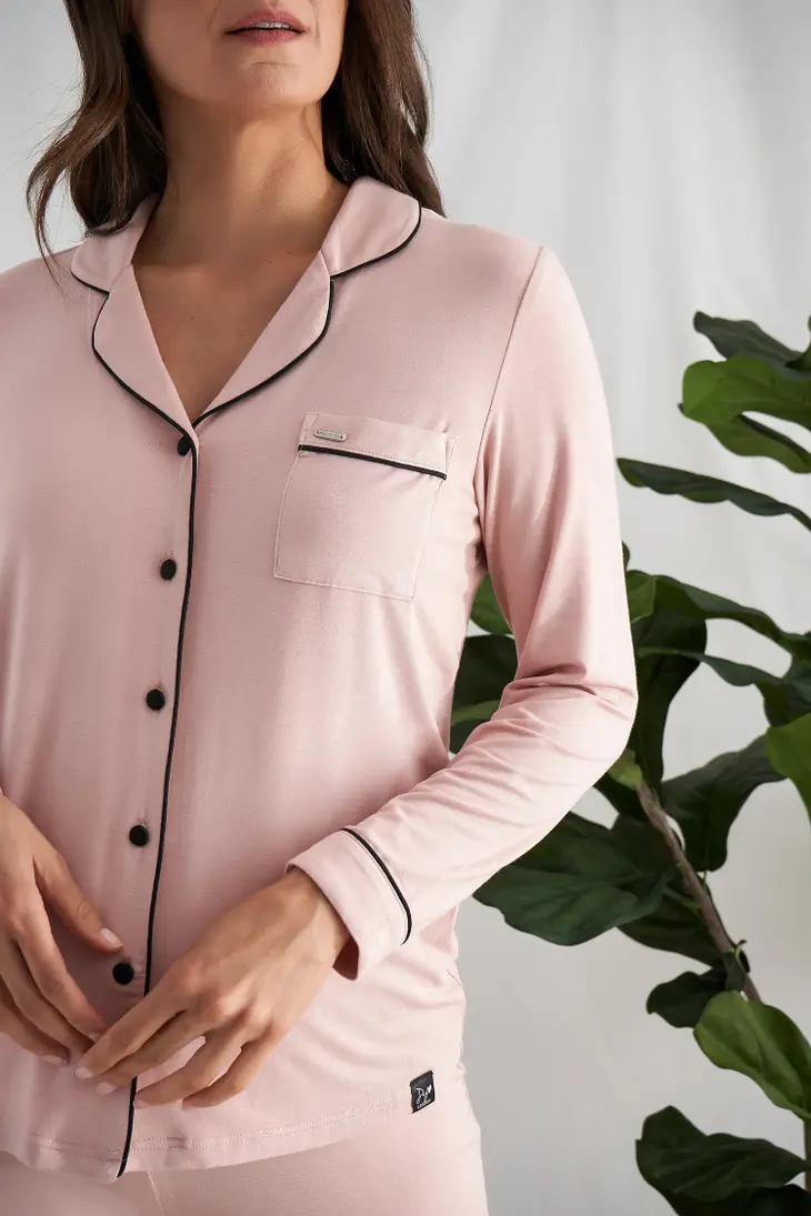 Women's pink bamboo pant pajama set with black piping buttons and front pocket