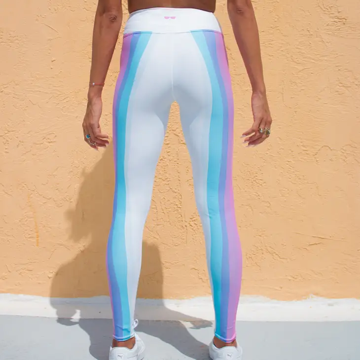 Women's pink and white cotton candy high waisted leggings on model
