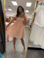 Women's pink pearl mini dress with bubble sleeves and babydoll style