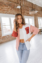 Women's pink and white button up shirt with front pocket