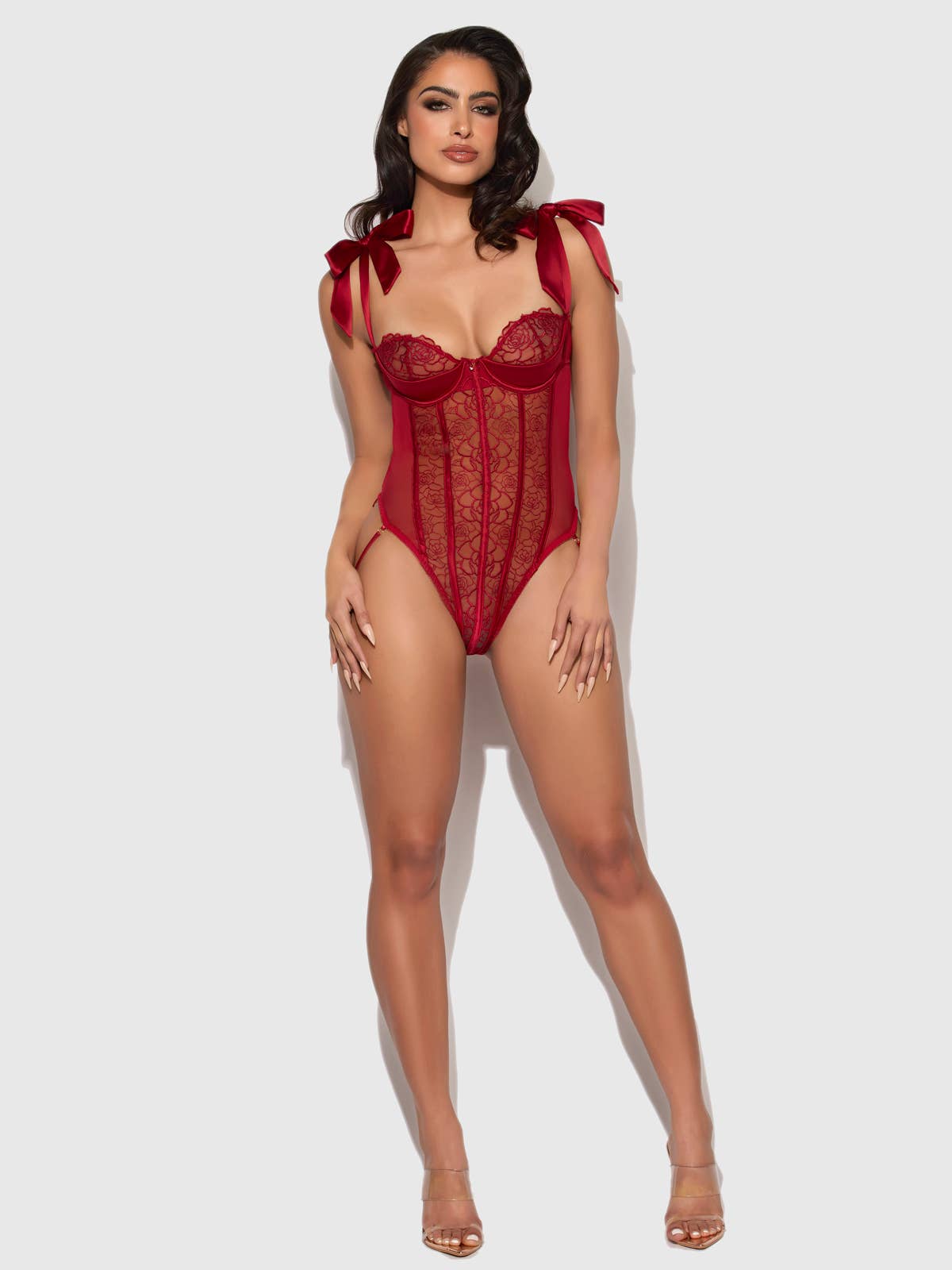 Women's red lace bodysuit lingerie with ribbon tie straps on model