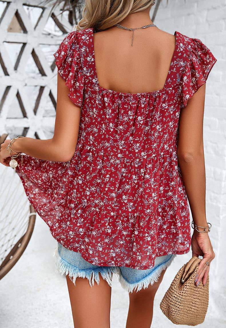 Women's red floral flowy tank top on model