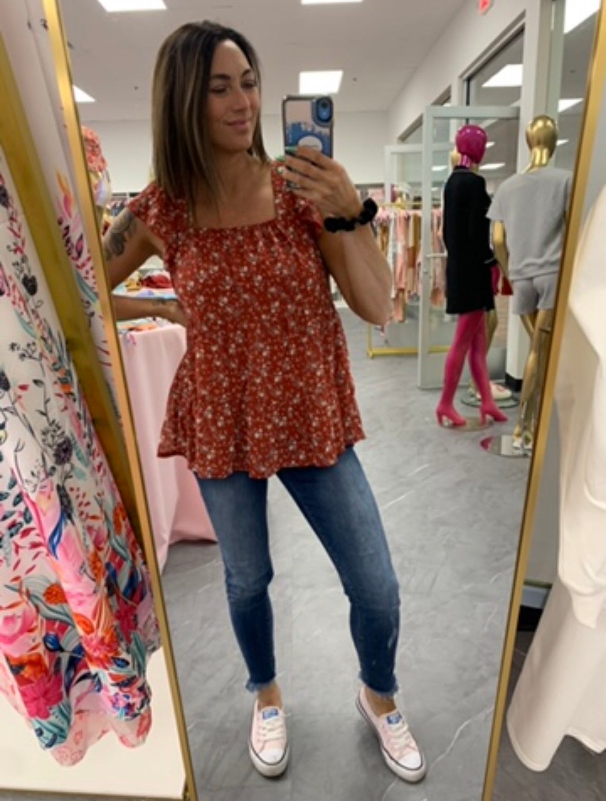 Women's red floral flowy tank top on model