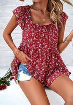 Women's red floral flowy tank top on model