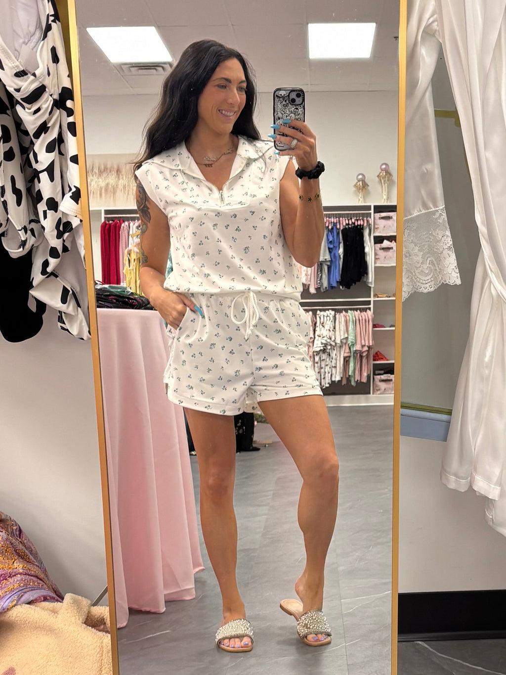 Women's white quarter zip sleeveless floral two piece set front full body model