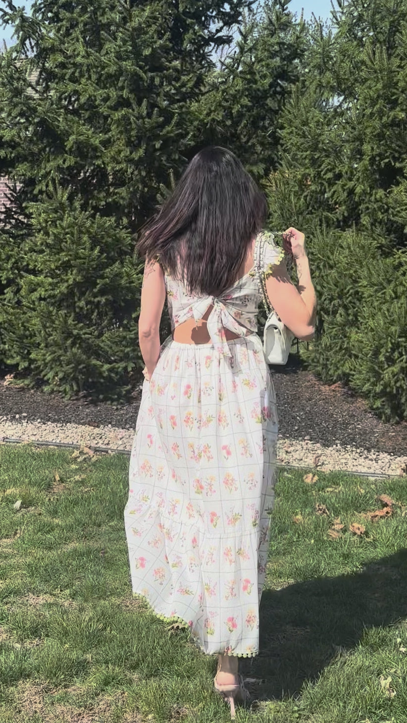 Women's white floral maxi dress with open tie back outside