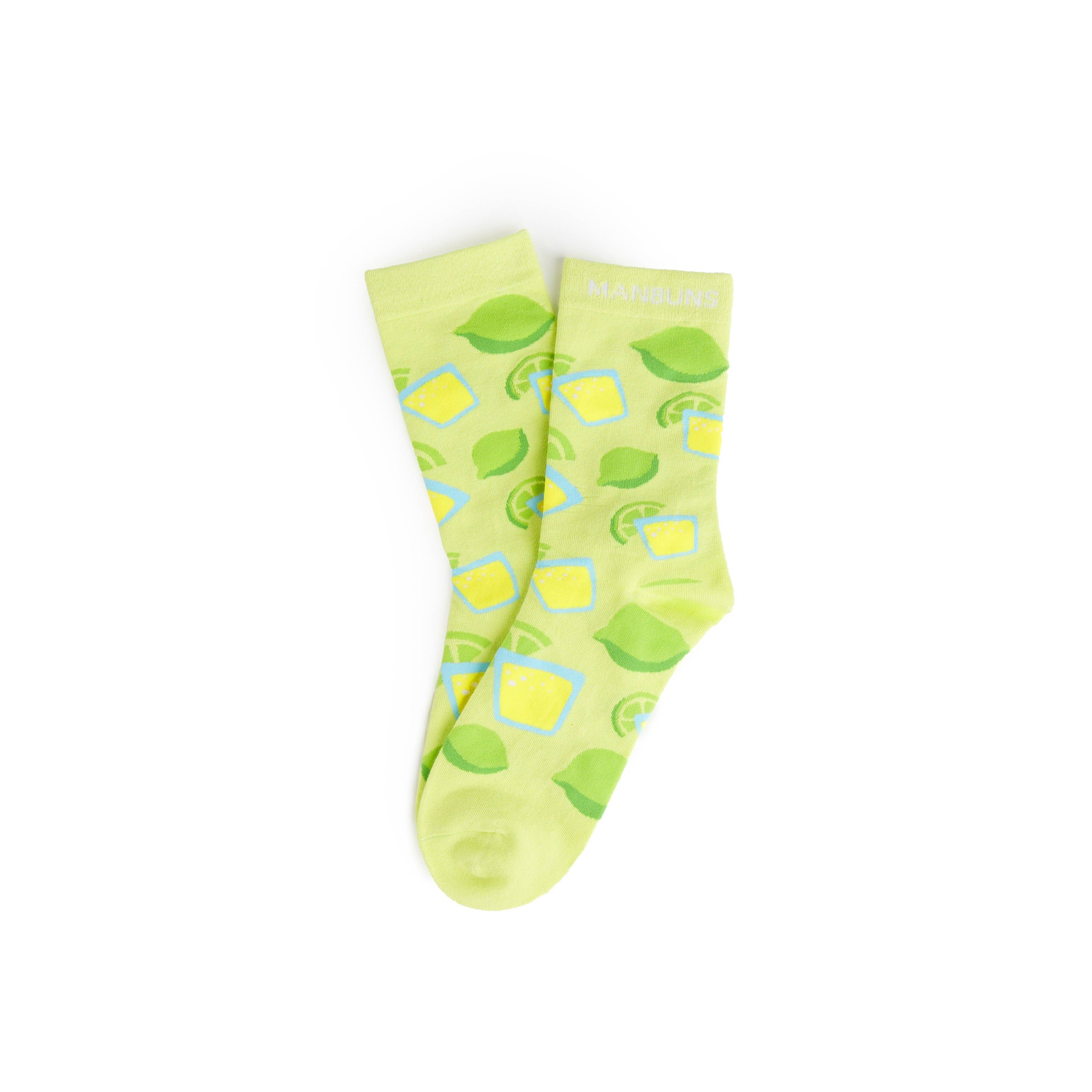 A pair of bright green unisex crew socks with a tequila shot pattern and the brand name 'Manbuns' printed on the ankle area.