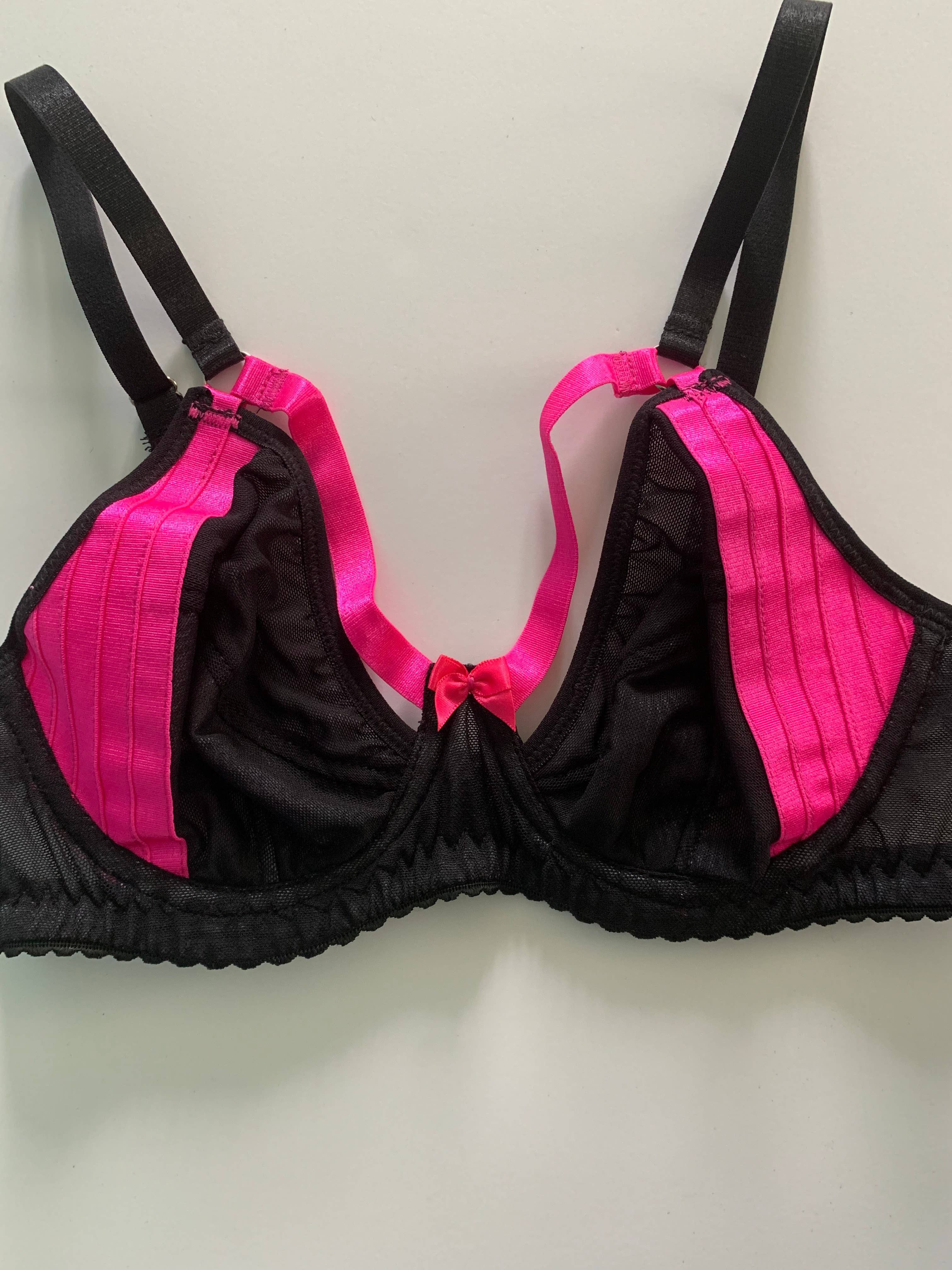 Women's black and hot pink bra with ribbon detail