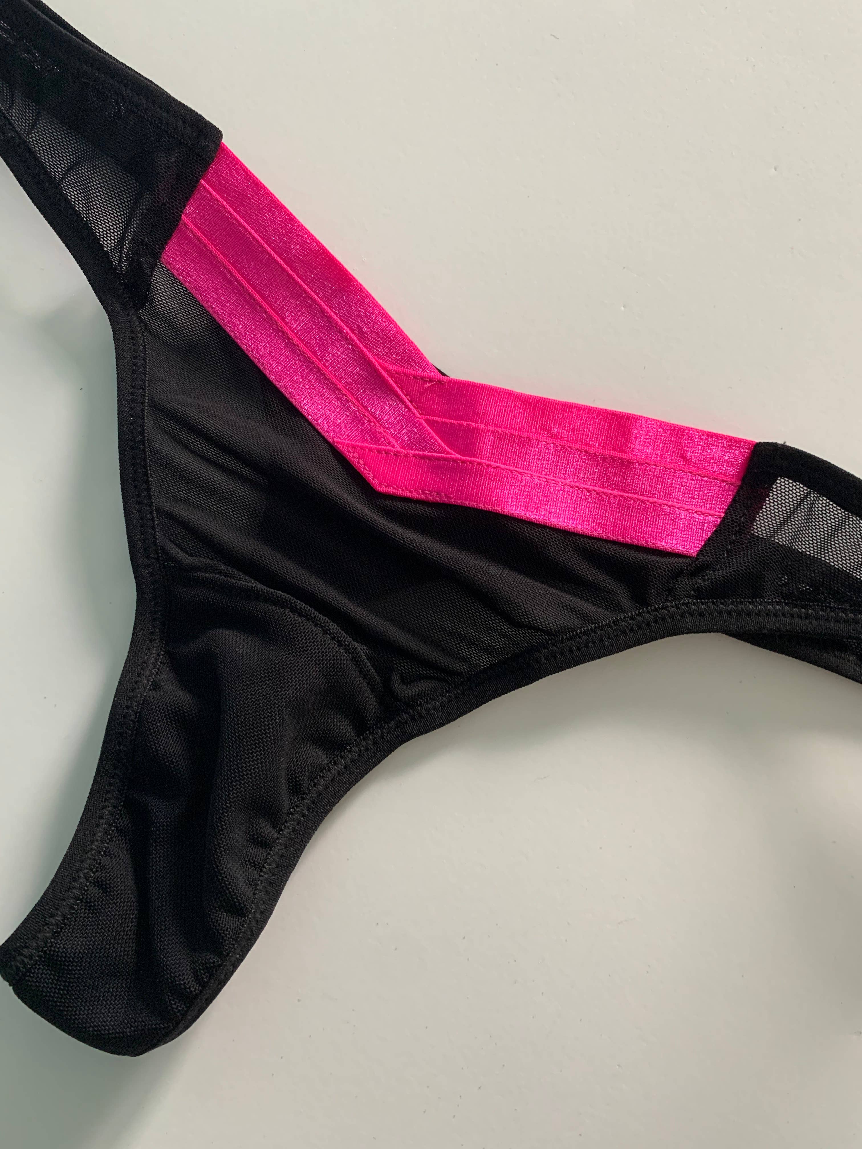 Women's pink and black mesh thong with criss cross pattern band