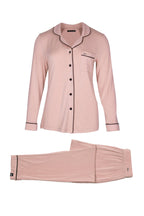 Women's pink bamboo pant pajama set with black piping buttons and front pocket
